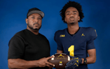 Travis Johnson with his father, Tory Johnson Sr.